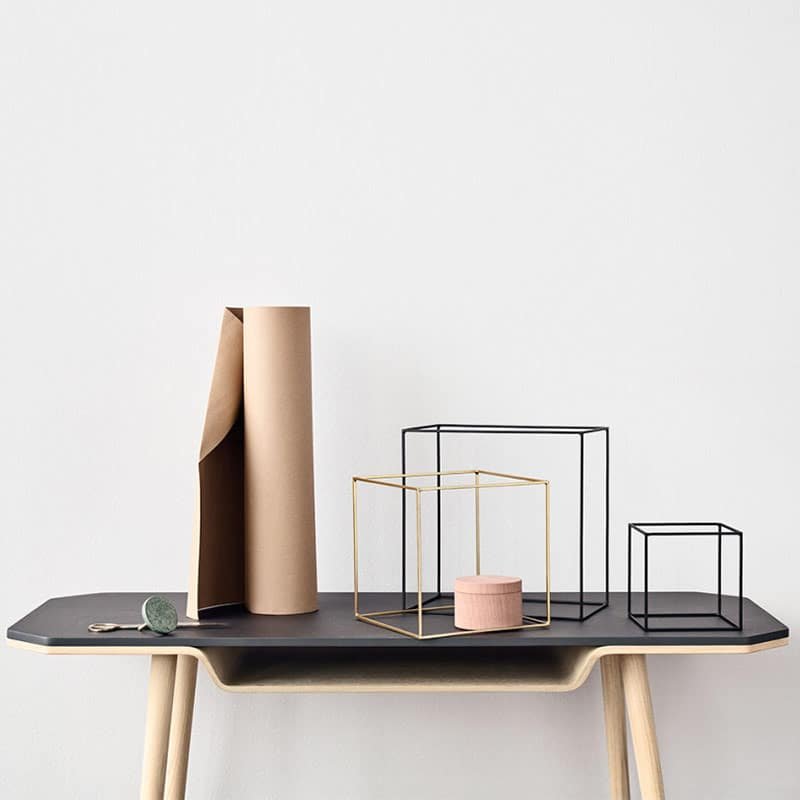 Woodmart theme demo photo of a black side table with geometric objects